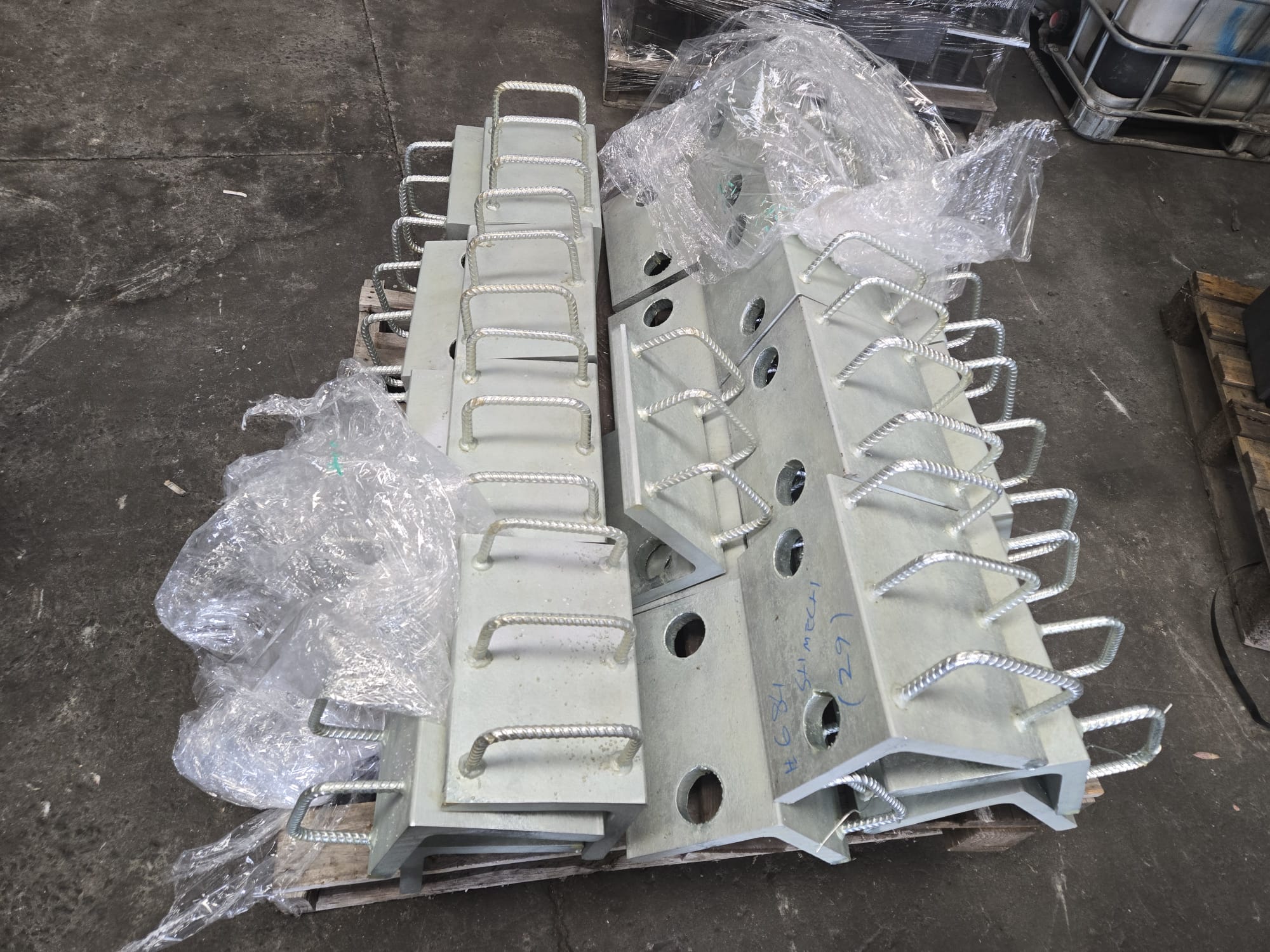 Real batch of galvanised Cast-In Plate components in the Lux workshop