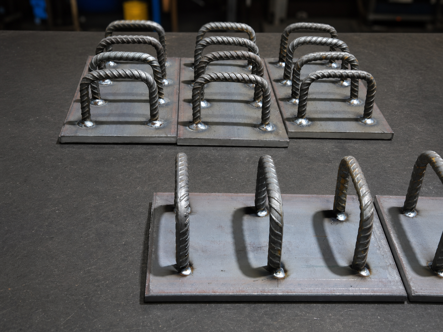 Professionally presented batch of fabricated Cast-In Plate assemblies