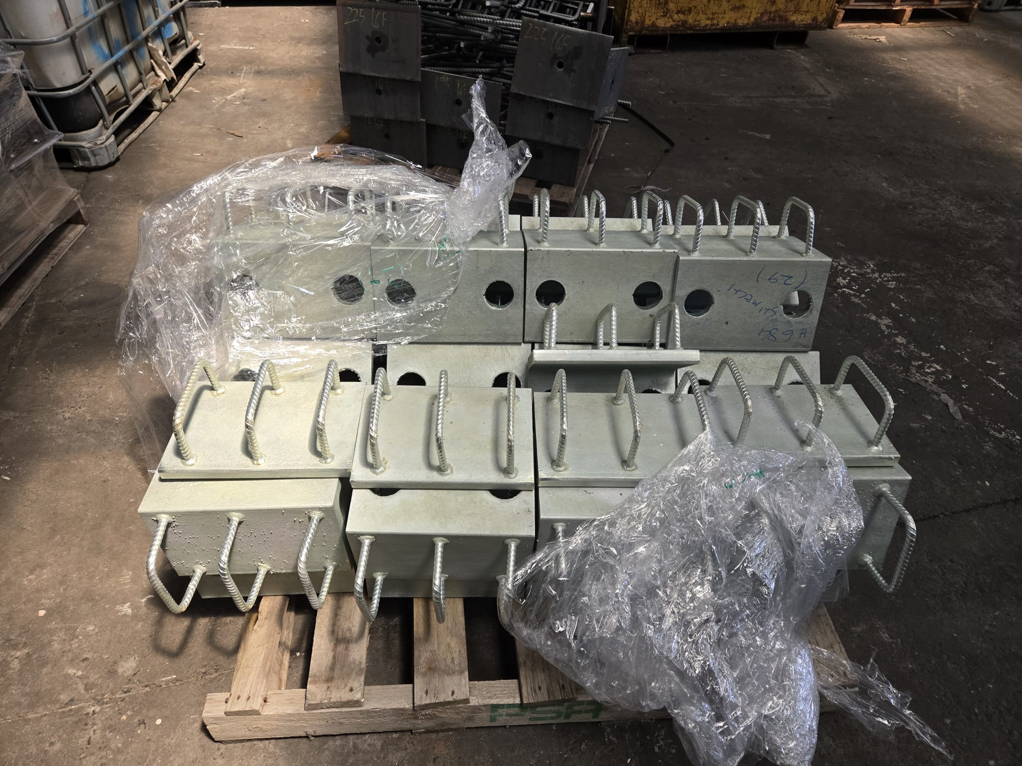 Galvanised Cast-In Plate channel assemblies arranged for delivery