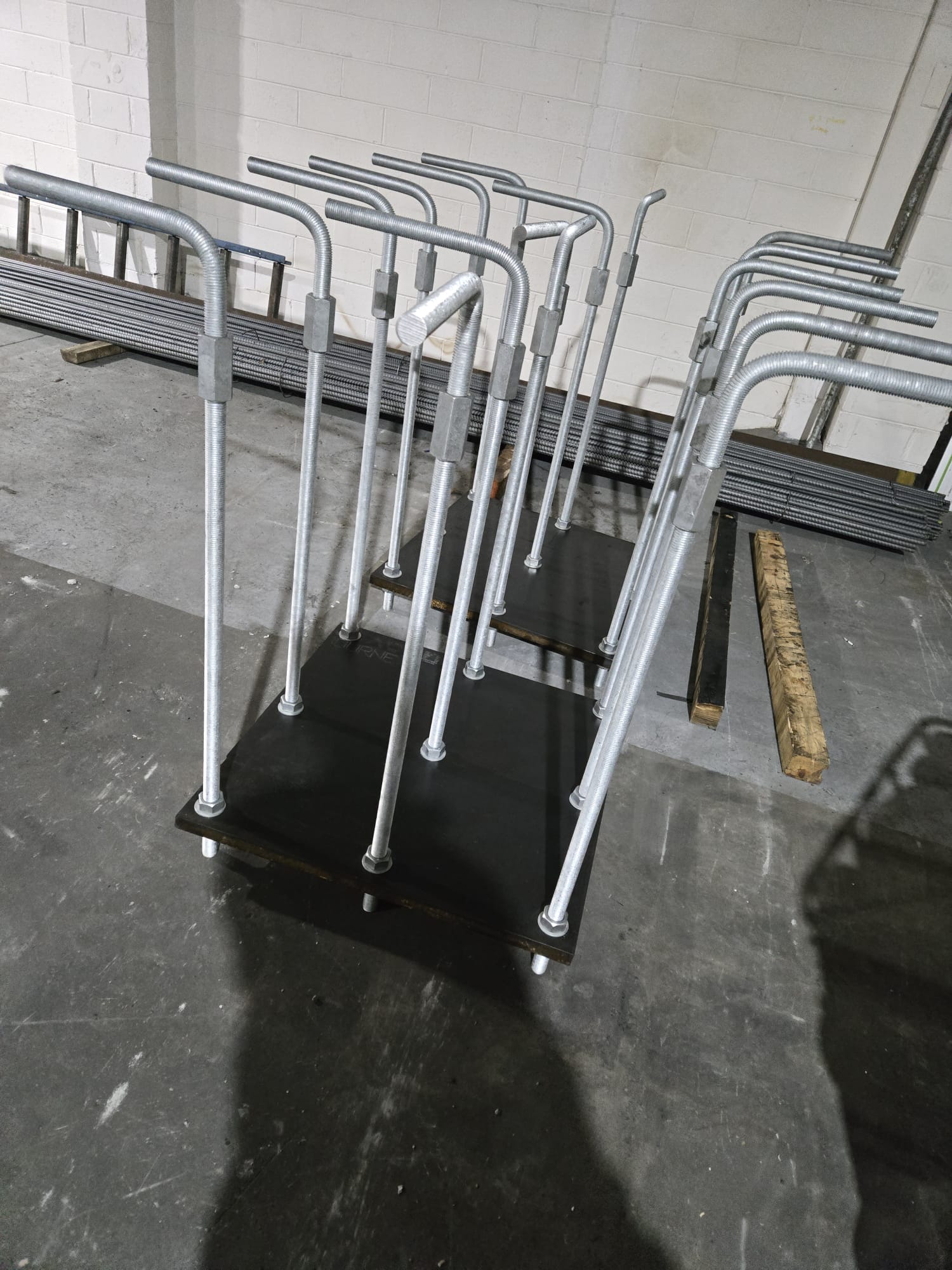 Tall threaded anchor assemblies fabricated on steel base plates