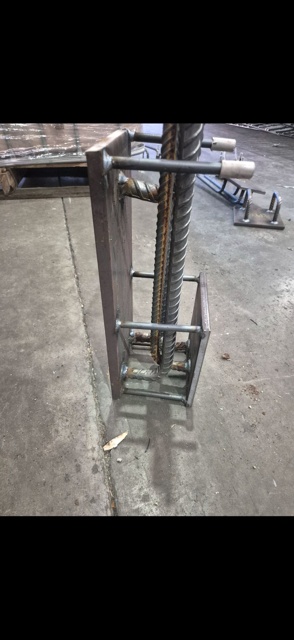 Close fabrication view of a reinforced steel Cast-In Plate assembly